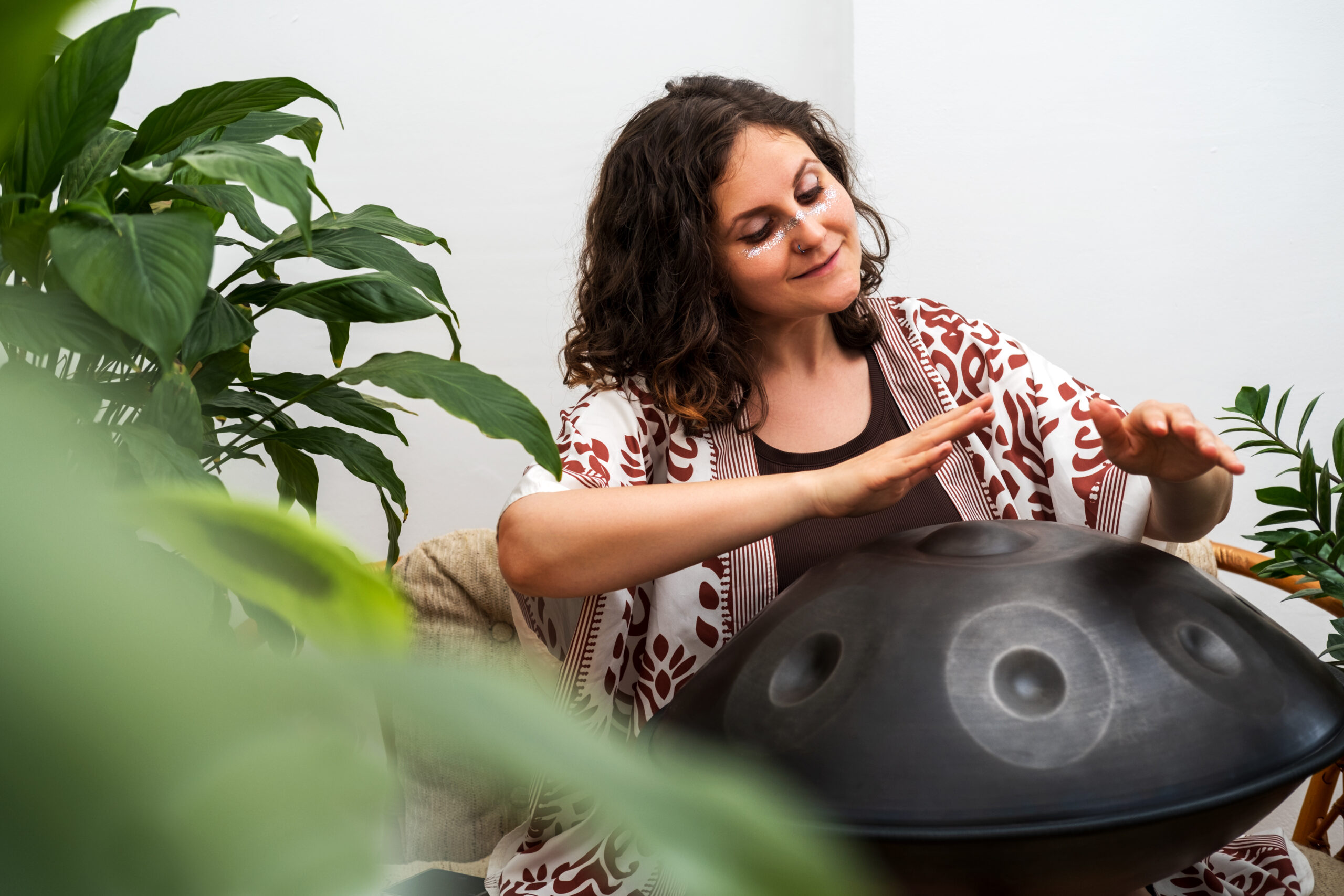 beautiful young woman plays relaxing music with ha 2025 03 06 14 16 48 utc scaled