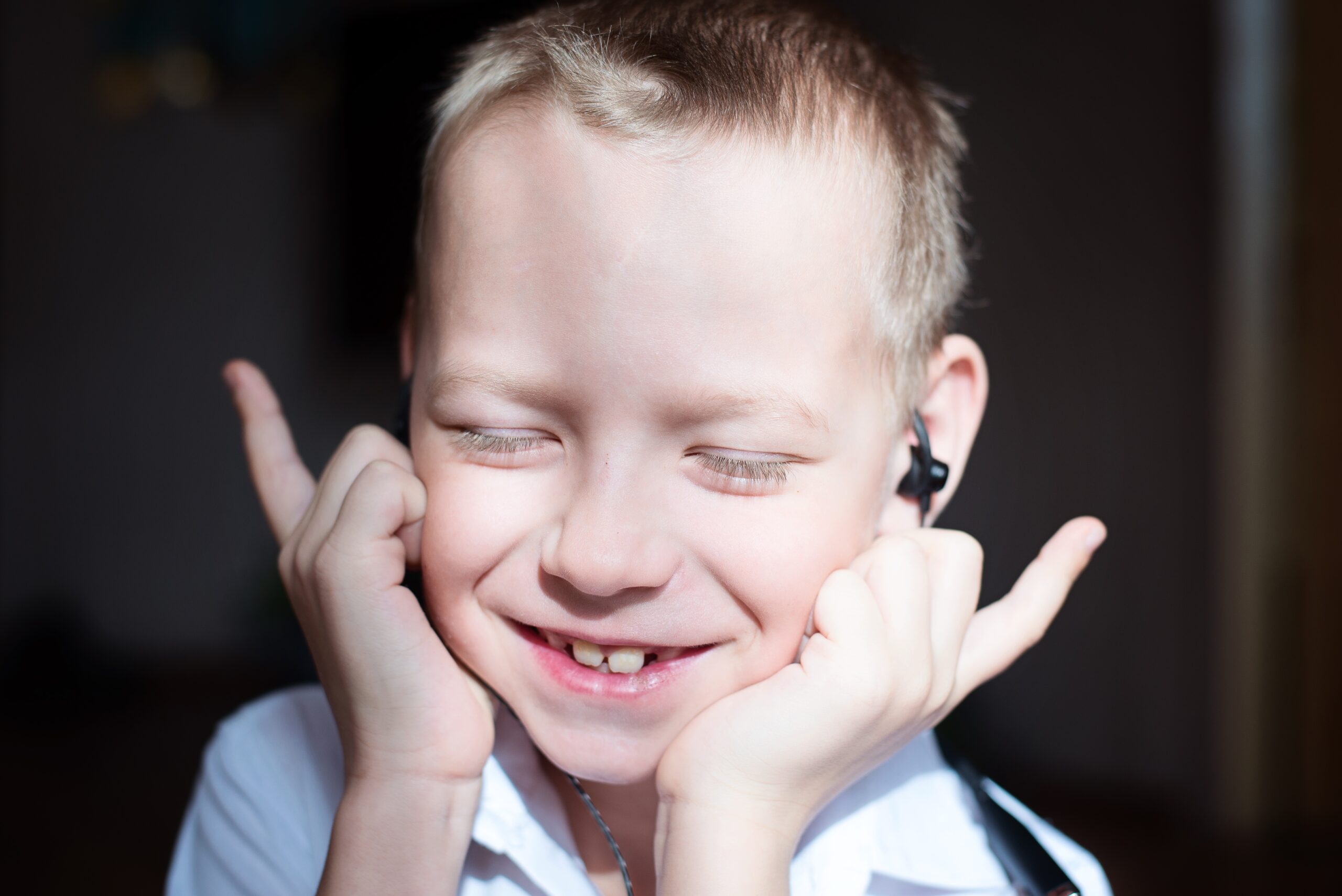 the-boy-listens-to-music-with-headphones-2025-01-08-20-37-46-utc the boy listens to music with headphones 2025 01 08 20 37 46 utc scaled