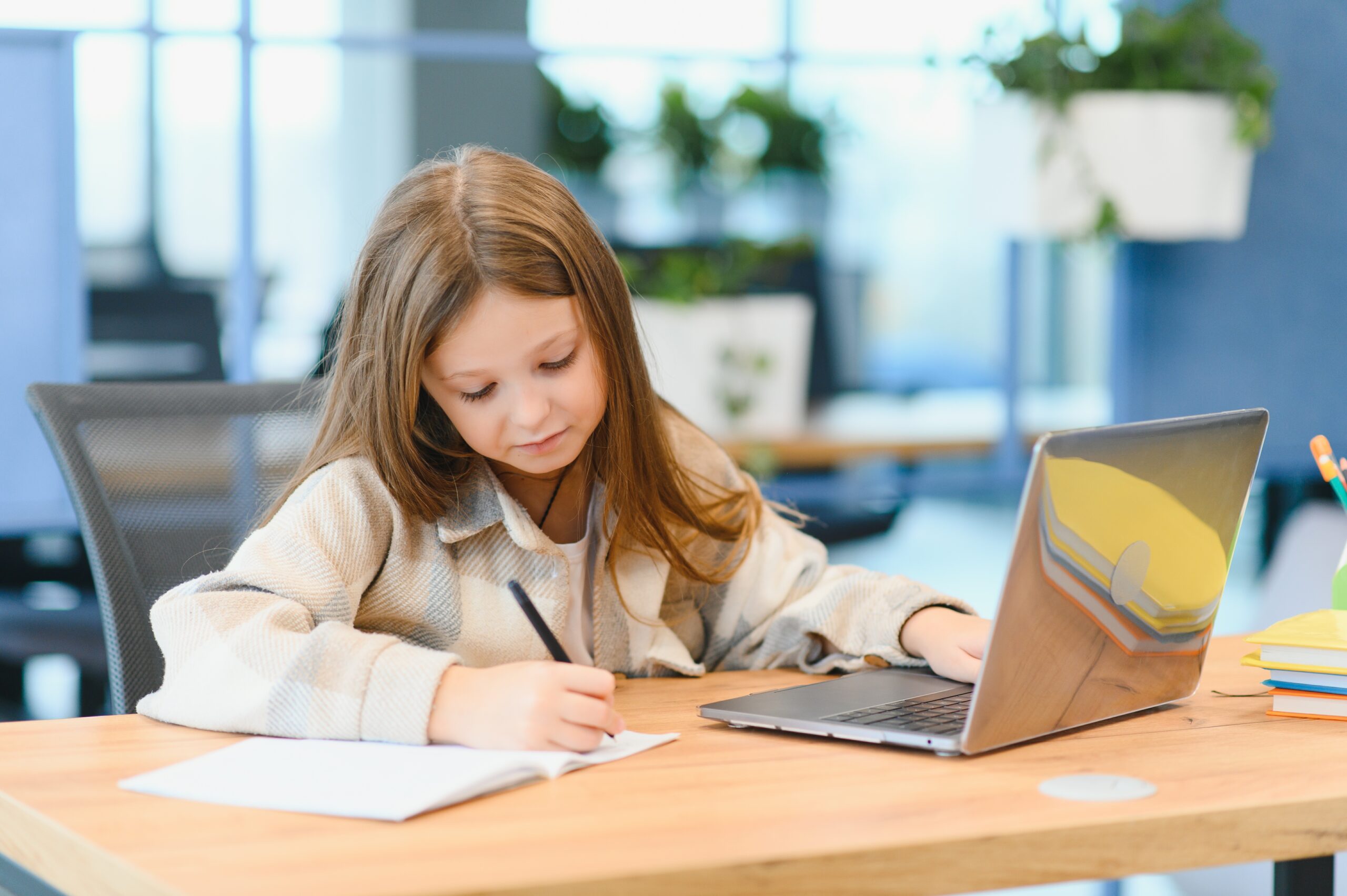 First day at school. Cute and happy little girl children using laptop computer, studying through online e-learning system first day at school cute and happy little girl ch 2026 01 09 01 09 11 utc scaled